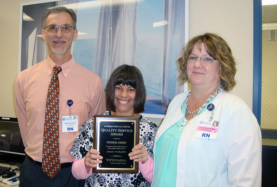 Vice President of Operations Neil McLaughlin (left) and Director of Medical/Surgical Lisa Salmon (right) are pictured with Pat Fisher, WVU Medicine Jefferson Medical Center’s Quality Service Award winner for the first quarter 2018.